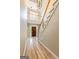 Bright foyer showcasing hardwood floors, stairs, and a front door with sidelights at 218 Woodruff Way, Peachtree City, GA 30269
