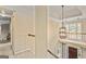 A welcoming foyer featuring a chandelier and staircase with natural light streaming in at 218 Woodruff Way, Peachtree City, GA 30269