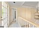 Upstairs hallway featuring neutral walls, carpet flooring, and an open doorway to another room at 218 Woodruff Way, Peachtree City, GA 30269