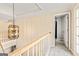 Hallway featuring neutral walls, carpet flooring, and an open doorway to another room at 218 Woodruff Way, Peachtree City, GA 30269