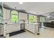 Bright kitchen with white cabinetry, stainless steel appliances and sight lines to the Gathering room at 218 Woodruff Way, Peachtree City, GA 30269