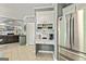 Kitchen featuring a coffee bar, stainless appliances, white cabinetry and tile floors at 218 Woodruff Way, Peachtree City, GA 30269