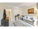 Cozy living room with a comfortable sofa, desk area, and natural light, perfect for relaxing or working from home at 218 Woodruff Way, Peachtree City, GA 30269