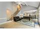 Open-concept living room with high ceilings and a staircase at 218 Woodruff Way, Peachtree City, GA 30269