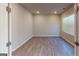 Bright and open bedroom showcasing hardwood flooring and ample natural light at 3 Roving Hills Cir, Cartersville, GA 30121