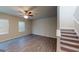 Living room featuring hardwood flooring, staircase, and natural light at 3 Roving Hills Cir, Cartersville, GA 30121