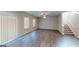 Bright living room featuring hardwood flooring and staircase at 3 Roving Hills Cir, Cartersville, GA 30121