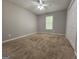 Neutral bedroom with carpeted floor, ceiling fan, and double door closet at 105 Old Hickory Pointe, Mcdonough, GA 30252