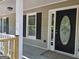 Welcoming front door with decorative window, framed by a covered porch and classic exterior details at 105 Old Hickory Pointe, Mcdonough, GA 30252