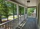 Picturesque porch view showcasing white railings and a serene outdoor living space, perfect for relaxation at 105 Old Hickory Pointe, Mcdonough, GA 30252