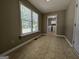 This room features a large window offering natural light and outside views, complemented by neutral walls and tile flooring at 105 Old Hickory Pointe, Mcdonough, GA 30252