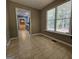 Bright room featuring a large window, neutral walls, and tile floors, offering natural light and open views of the surrounding area at 105 Old Hickory Pointe, Mcdonough, GA 30252