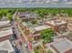 Aerial view of the neighborhood featuring brick buildings, tree-lined streets and beautiful landscape at 1128 Milstead Ne Ave, Conyers, GA 30012