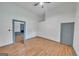 Bright bedroom features an open doorway and wood flooring with natural light at 1128 Milstead Ne Ave, Conyers, GA 30012
