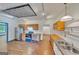 Spacious kitchen with wood floors, modern appliances, wood cabinets, and stylish lighting at 1128 Milstead Ne Ave, Conyers, GA 30012