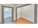 Unfinished laundry room adjacent to bathroom with hardwood floors at 1128 Milstead Ne Ave, Conyers, GA 30012