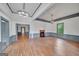 Spacious living room with hardwood floors, wainscoting detail, and neutral tones at 1128 Milstead Ne Ave, Conyers, GA 30012
