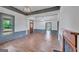 Light-filled living room with wood floors, wainscoting, and a stained-glass front door at 1128 Milstead Ne Ave, Conyers, GA 30012