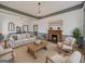 Comfortable living room showcasing cozy furniture, a fireplace and a welcoming ambiance at 1128 Milstead Ne Ave, Conyers, GA 30012