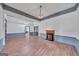 Expansive living room featuring hardwood floors, wainscoting and a fireplace at 1128 Milstead Ne Ave, Conyers, GA 30012