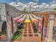 Charming outdoor seating area adorned with colorful umbrellas and cafe-style tables at 1128 Milstead Ne Ave, Conyers, GA 30012