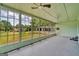 Bright sunroom with multiple windows overlooking a lush landscape at 1128 Milstead Ne Ave, Conyers, GA 30012