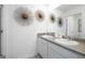 Bright bathroom featuring a double sink vanity with modern fixtures and decorative accents at 560 Whitman Ln # 2016, Stockbridge, GA 30281