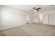 Spacious carpeted bedroom with multiple doors leading to other rooms and abundant natural light at 560 Whitman Ln # 2016, Stockbridge, GA 30281