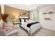 Whimsical bedroom with unique decor, ample natural light, and a comfortable bed at 560 Whitman Ln # 2016, Stockbridge, GA 30281