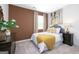 Cozy bedroom with a decorative dresser, bright window and soothing color scheme at 560 Whitman Ln # 2016, Stockbridge, GA 30281