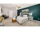 Comfortable bedroom with plush carpet, stylish decor, and a ceiling fan for added comfort at 560 Whitman Ln # 2016, Stockbridge, GA 30281