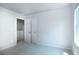 Neutral bedroom with light carpet and closet doors at 560 Whitman Ln # 2016, Stockbridge, GA 30281