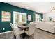 Inviting dining area with stylish chairs, a round table, and an open view to the living room at 560 Whitman Ln # 2016, Stockbridge, GA 30281