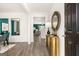 Welcoming entryway with stylish decor, hardwood floors, and an open view to the dining and living areas at 560 Whitman Ln # 2016, Stockbridge, GA 30281