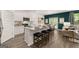 Modern kitchen with stainless steel appliances, granite countertops, and an island with breakfast bar at 560 Whitman Ln # 2016, Stockbridge, GA 30281