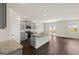 Eat-in kitchen features granite counters, a large island, stainless steel appliances, and grey cabinets at 560 Whitman Ln # 2016, Stockbridge, GA 30281