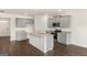 Eat-in kitchen with gray cabinets, granite countertops, a large island, and stainless steel appliances at 560 Whitman Ln # 2016, Stockbridge, GA 30281