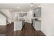 Bright eat-in kitchen with stainless steel appliances, granite countertops, island, and grey cabinets at 560 Whitman Ln # 2016, Stockbridge, GA 30281