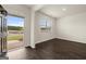Bright living room showcases wood floors, a window and open access to the front yard at 560 Whitman Ln # 2016, Stockbridge, GA 30281