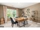 Comfortable home office space with a wooden desk, decorative wall art, and natural light at 560 Whitman Ln # 2016, Stockbridge, GA 30281