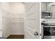 Walk-in pantry with white wire shelving at 560 Whitman Ln # 2016, Stockbridge, GA 30281