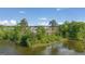 Another view of a scenic pond surrounded by lush greenery, providing a peaceful natural setting at 560 Whitman Ln # 2016, Stockbridge, GA 30281