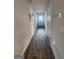 Hallway featuring wood floors, neutral walls, and doors leading to various rooms at 4838 Station Lane # 15, Union City, GA 30349