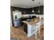 Modern kitchen with stainless steel appliances, granite countertops, and dark wood cabinetry at 4838 Station Lane # 15, Union City, GA 30349