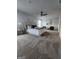 Large main bedroom with a comfy king bed, soft carpet, and a modern ceiling fan at 4838 Station Lane # 15, Union City, GA 30349