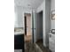 Bathroom featuring dual sinks, granite countertops, modern fixtures, and ample lighting at 4839 Station Lane # 25, Union City, GA 30349