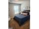 Cozy bedroom featuring plush carpet, window with blinds, and tasteful baseball-themed decor at 4839 Station Lane # 25, Union City, GA 30349