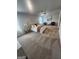 Spacious main bedroom featuring neutral walls, a ceiling fan, plush carpet and ample natural light at 4839 Station Lane # 25, Union City, GA 30349