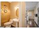 Powder room with pedestal sink, ornate mirror, and decorative wallpaper accent wall at 3192 Paces Mill Se Rd, Atlanta, GA 30339
