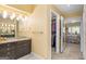 Bright bathroom with granite countertops, a closet, and modern vanity with lighting at 3192 Paces Mill Se Rd, Atlanta, GA 30339